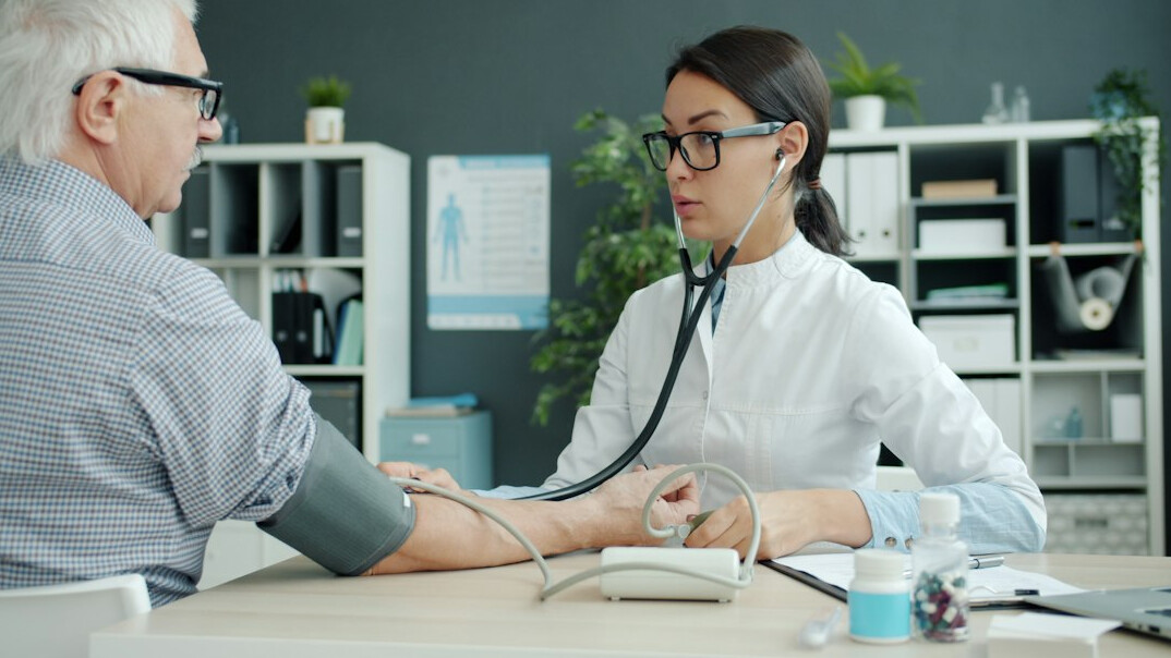 senior person with doctor